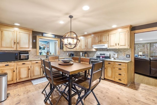 285 Still River Rd, Bolton, MA 01740 - kitchen with black microwave, range with two ovens, under cabinet range hood, and light brown cabinets