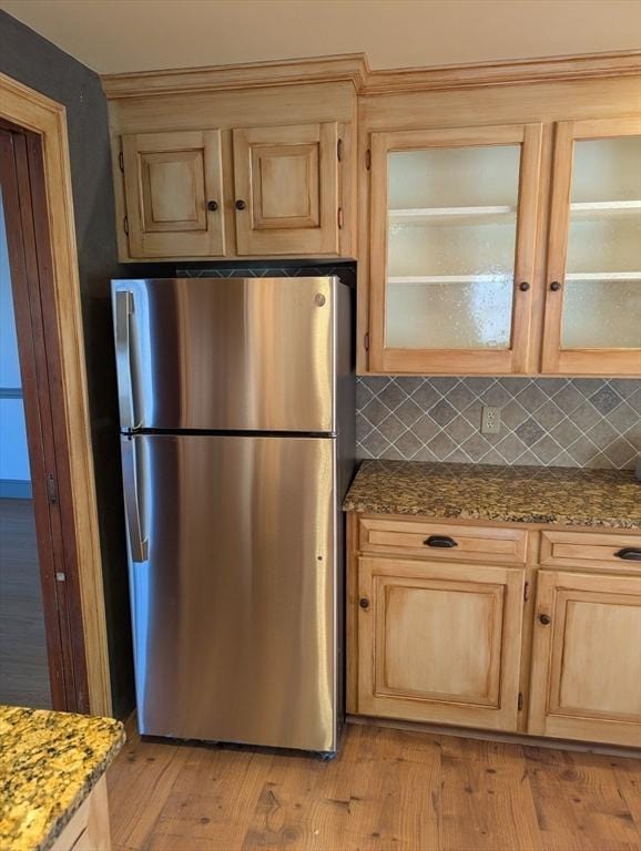 285 Still River Rd, Bolton, MA 01740 - kitchen featuring glass insert cabinets, light wood finished floors, freestanding refrigerator, and tasteful backsplash