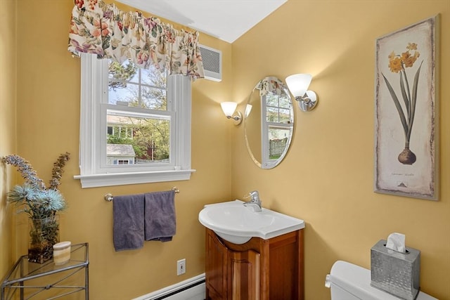 half bathroom featuring toilet and vanity