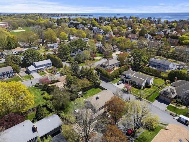 birds eye view of property featuring a water view and a residential view