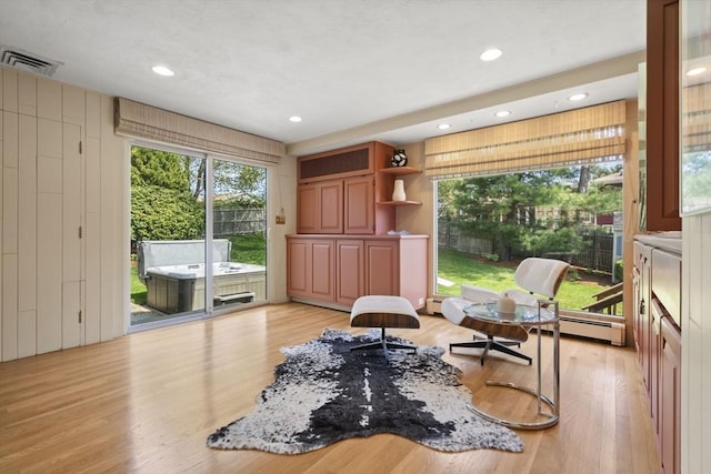 living area featuring light wood finished floors, visible vents, and recessed lighting