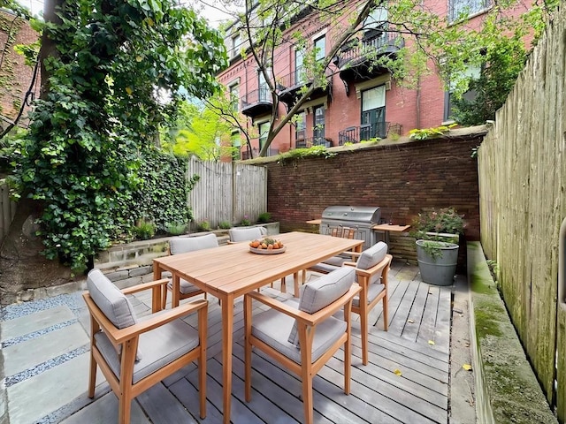191 W Canton Unit 1, Boston, MA 02116 - wooden terrace featuring outdoor dining area, a fenced backyard, and a grill