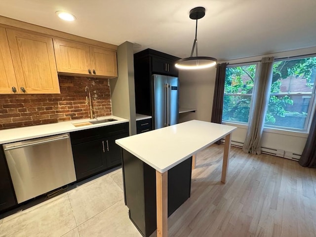 191 W Canton Unit 1, Boston, MA 02116 - kitchen with stainless steel appliances, a sink, light countertops, decorative backsplash, and recessed lighting