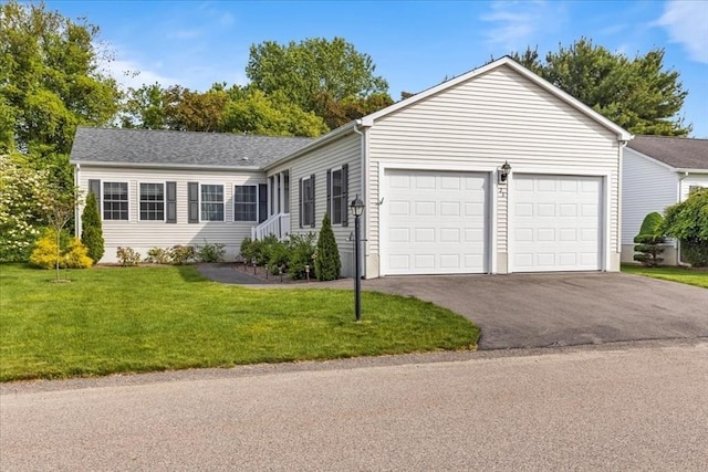 23 Brookstone Unit 23, Bridgewater, MA 02324 - single story home featuring a garage, asphalt driveway, and a front yard