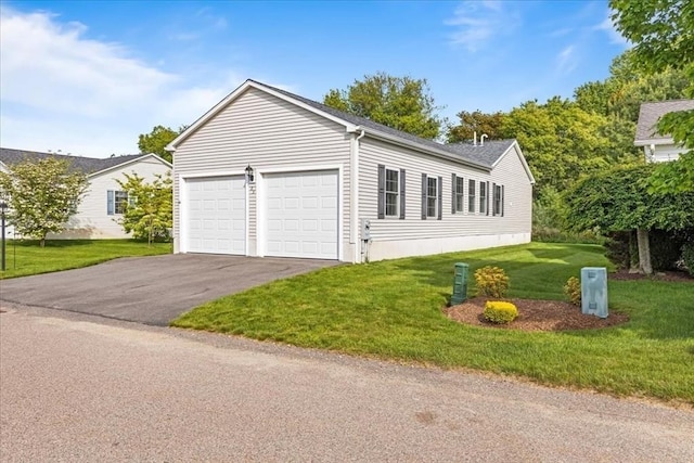 23 Brookstone Unit 23, Bridgewater, MA 02324 - view of front facade featuring a garage, driveway, a front yard, and roof with shingles