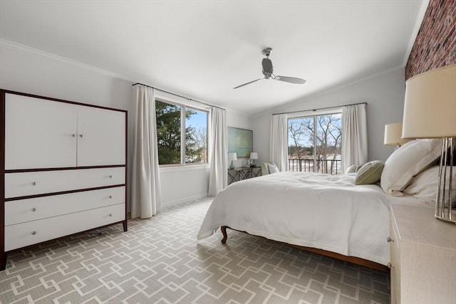 bedroom with crown molding, multiple windows, and vaulted ceiling