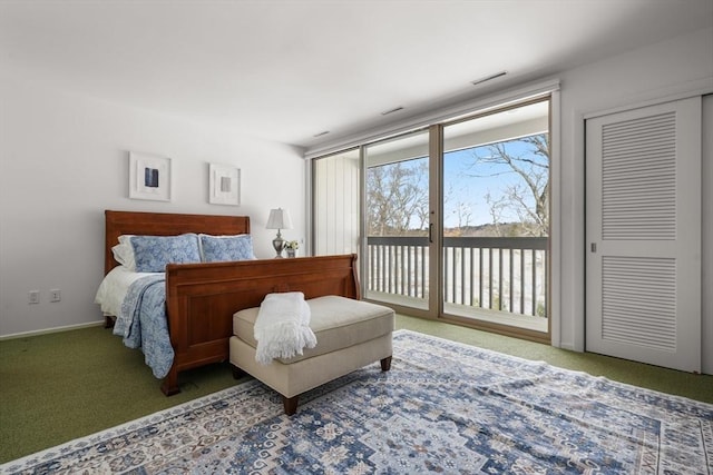 bedroom with access to outside, carpet, visible vents, and baseboards