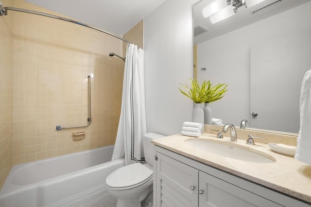 bathroom with shower / bath combo, visible vents, vanity, and toilet