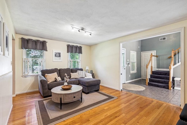 2 Strawstone Ln, Norton, MA 02766 - living room with hardwood / wood-style floors, stairway, and baseboards