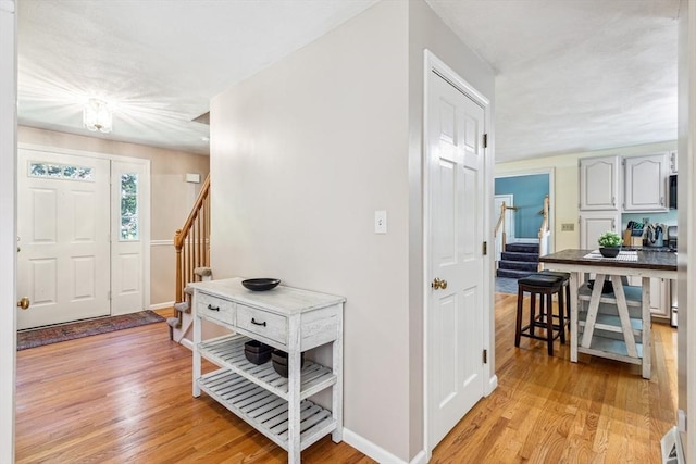 2 Strawstone Ln, Norton, MA 02766 - foyer entrance with stairs, light wood-style flooring, and baseboards