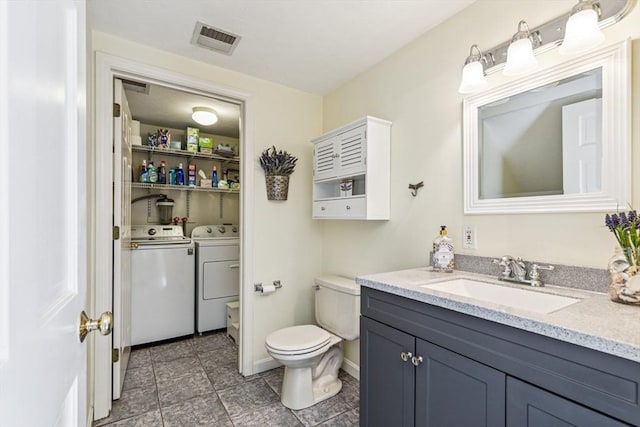2 Strawstone Ln, Norton, MA 02766 - bathroom with independent washer and dryer, vanity, toilet, baseboards, and tile patterned flooring