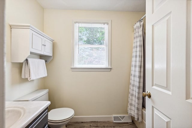 2 Strawstone Ln, Norton, MA 02766 - bathroom featuring toilet, baseboards, vanity, wood finished floors, and shower / bath combo