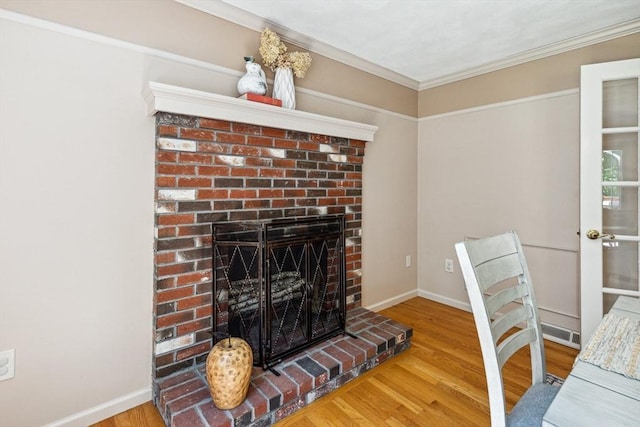 2 Strawstone Ln, Norton, MA 02766 - living room featuring a fireplace, wood finished floors, ornamental molding, and baseboards