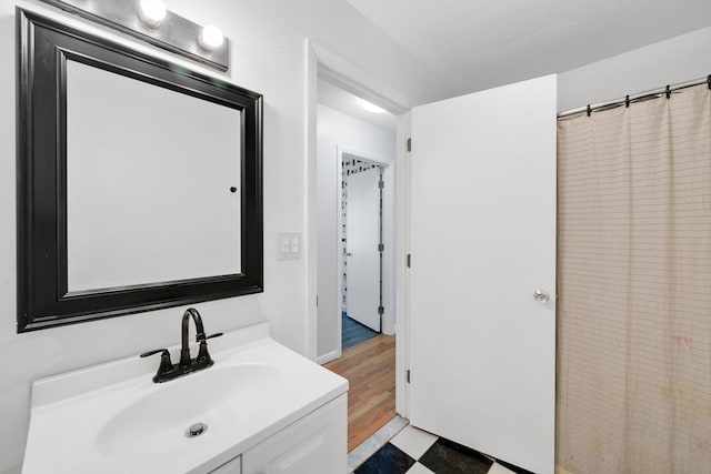 bathroom with vanity and tile patterned floors