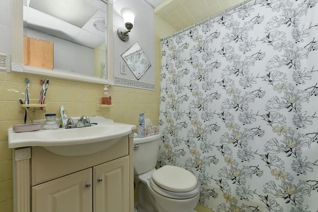 127 Beacon St, Chelsea, MA 02150 - full bathroom featuring tile walls, toilet, a shower with curtain, and vanity