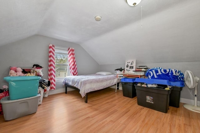 127 Beacon St, Chelsea, MA 02150 - bedroom with lofted ceiling and wood finished floors