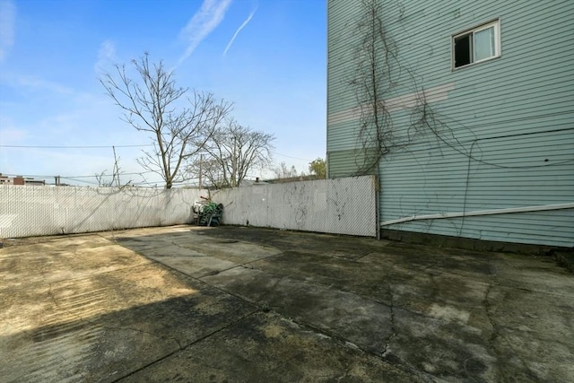 127 Beacon St, Chelsea, MA 02150 - view of home's exterior featuring a patio area and fence