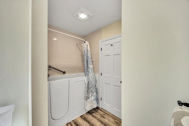 laundry room with light wood-style floors