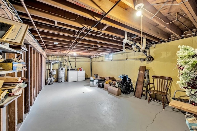 basement with washer and dryer and water heater