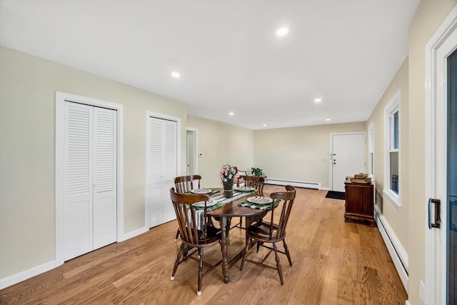 dining area featuring recessed lighting, light wood-style floors, and baseboard heating