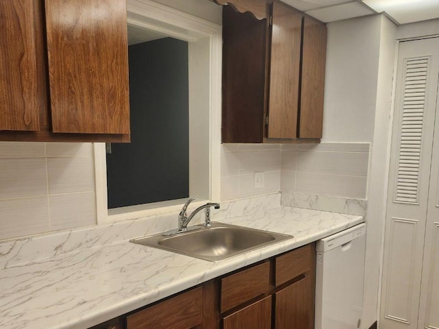 55 Greentree Ln Unit 27, Weymouth, MA 02190 - kitchen with white dishwasher, light countertops, and tasteful backsplash