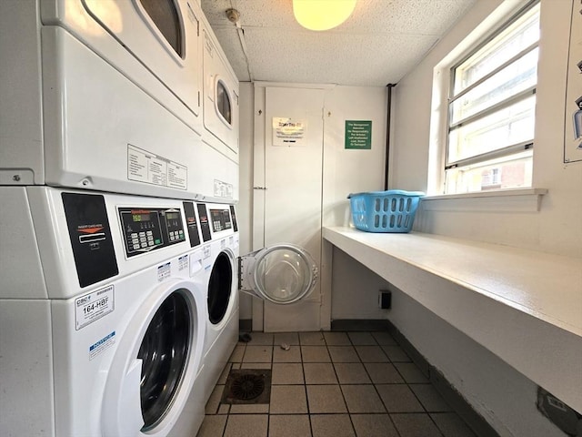 55 Greentree Ln Unit 27, Weymouth, MA 02190 - community laundry room with estacked washer and dryer, independent washer and dryer, and dark tile patterned flooring