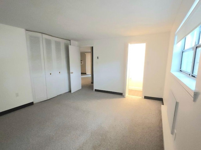55 Greentree Ln Unit 27, Weymouth, MA 02190 - unfurnished bedroom with light colored carpet and a closet