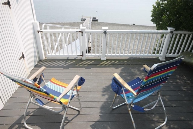 deck featuring a water view