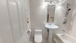 bathroom featuring toilet and shower / bathtub combination