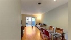 dining area with hardwood / wood-style flooring