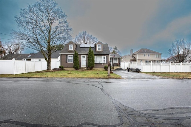 10 Albermarle St, Methuen, MA 01844 - cape cod-style house featuring solar panels, a residential view, and driveway