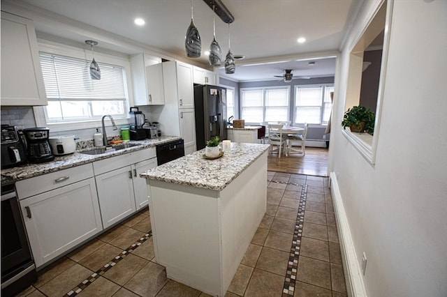 10 Albermarle St, Methuen, MA 01844 - kitchen with a sink, inlaid floor details, black dishwasher, healthy amount of natural light, and recessed lighting
