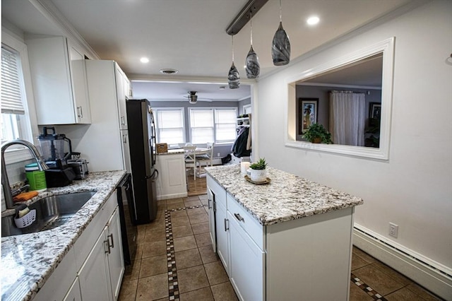 10 Albermarle St, Methuen, MA 01844 - kitchen featuring freestanding refrigerator, a baseboard heating unit, inlaid floor details, a center island, and recessed lighting