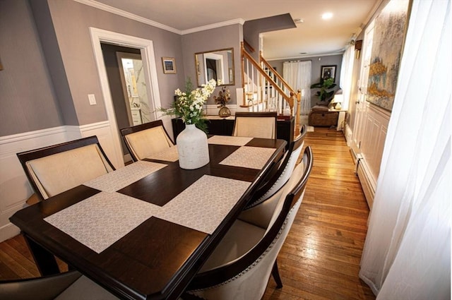 10 Albermarle St, Methuen, MA 01844 - dining room featuring hardwood / wood-style flooring, stairs, a baseboard heating unit, crown molding, and wainscoting