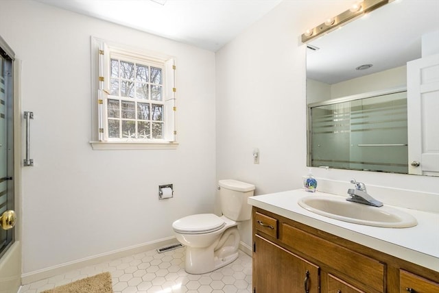 53 Wingfoot Dr, Barnstable, MA 02675 - full bath featuring baseboards, toilet, vanity, and tile patterned flooring