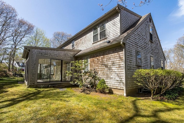 53 Wingfoot Dr, Barnstable, MA 02675 - back of property with a yard and a shingled roof