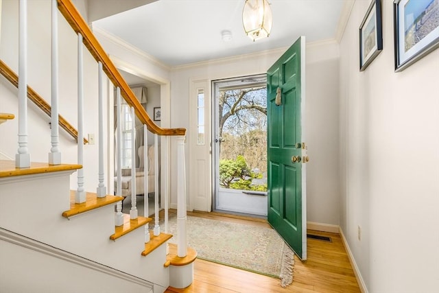 53 Wingfoot Dr, Barnstable, MA 02675 - entrance foyer with stairs, light wood-type flooring, ornamental molding, and baseboards