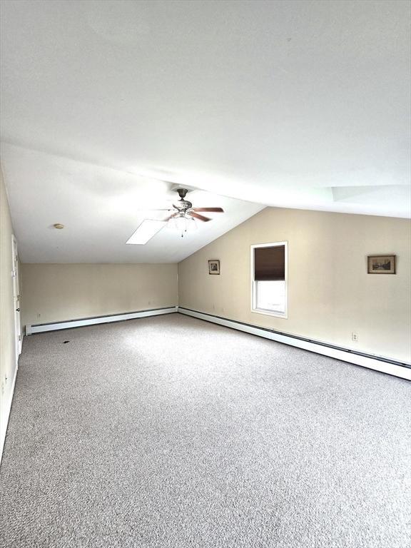 94 Barton St Unit 3, Pawtucket, RI 02860 - spare room featuring a ceiling fan, vaulted ceiling, carpet, and a skylight