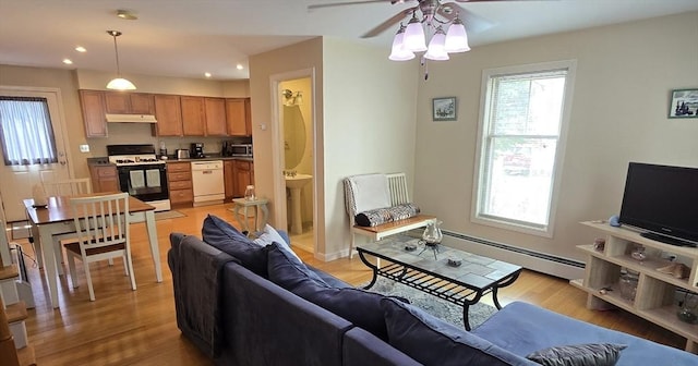 94 Barton St Unit 3, Pawtucket, RI 02860 - living room with a baseboard radiator, ceiling fan, light wood-type flooring, and recessed lighting
