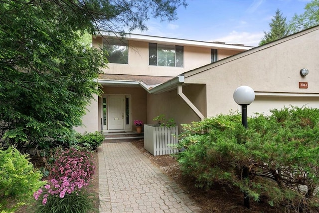 204 Allandale Rd Unit A, Boston, MA 02467 - property entrance with stucco siding