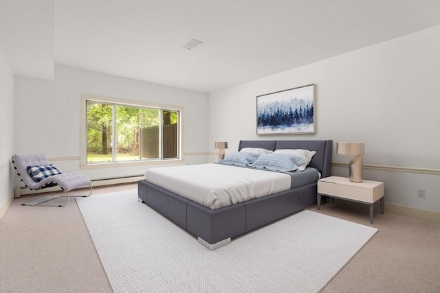 204 Allandale Rd Unit A, Boston, MA 02467 - carpeted bedroom with a baseboard heating unit and baseboards