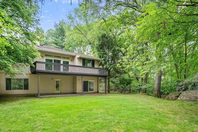 204 Allandale Rd Unit A, Boston, MA 02467 - back of house featuring stucco siding and a lawn