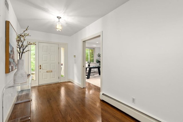 204 Allandale Rd Unit A, Boston, MA 02467 - entryway with a baseboard radiator, dark wood-style flooring, and baseboards