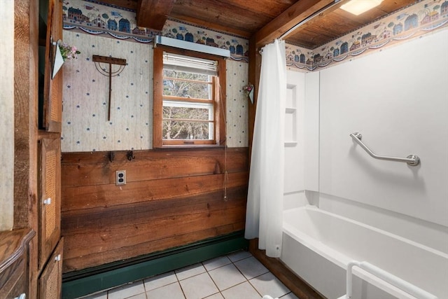 full bathroom featuring tile patterned floors, wood walls, wooden ceiling, and shower / tub combo with curtain