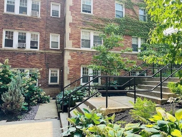 exterior space featuring brick siding