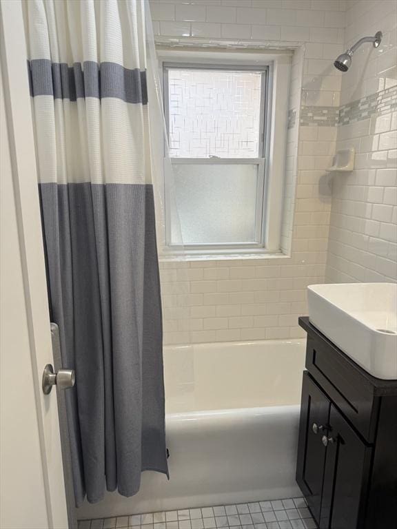 bathroom featuring shower / bathtub combination with curtain and vanity