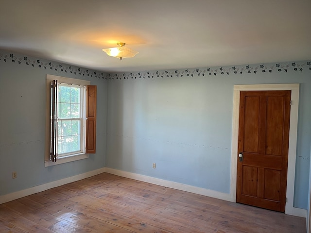 unfurnished room featuring wood-type flooring