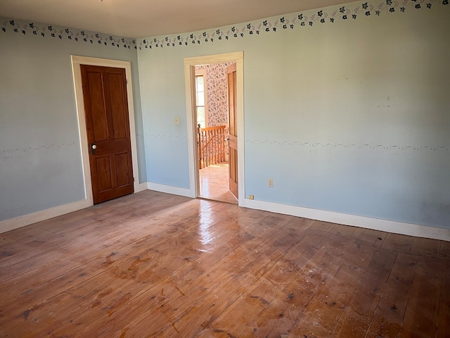 empty room with dark hardwood / wood-style floors