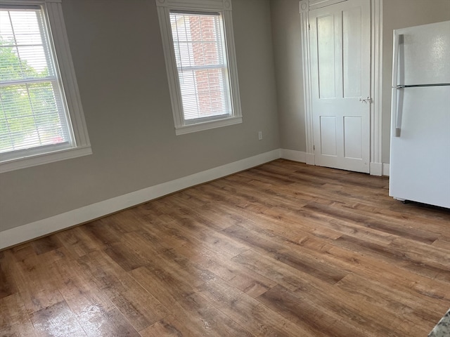 unfurnished dining area featuring hardwood / wood-style flooring