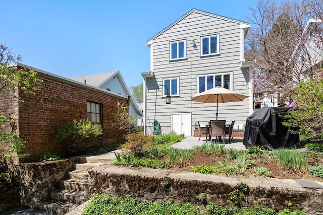 rear view of property with a patio